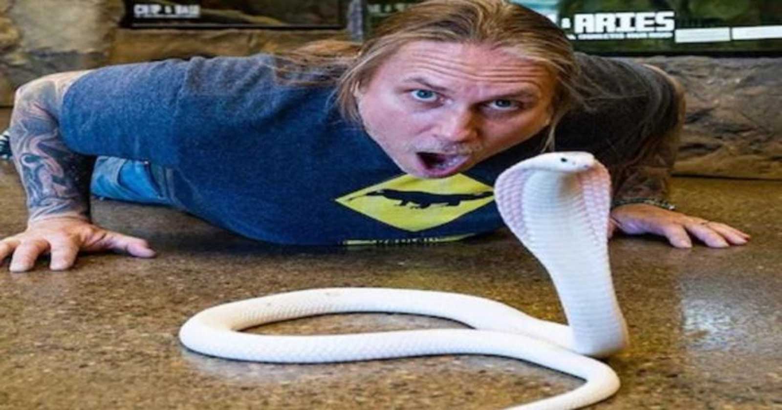 white snake man playing with white snake video viral 