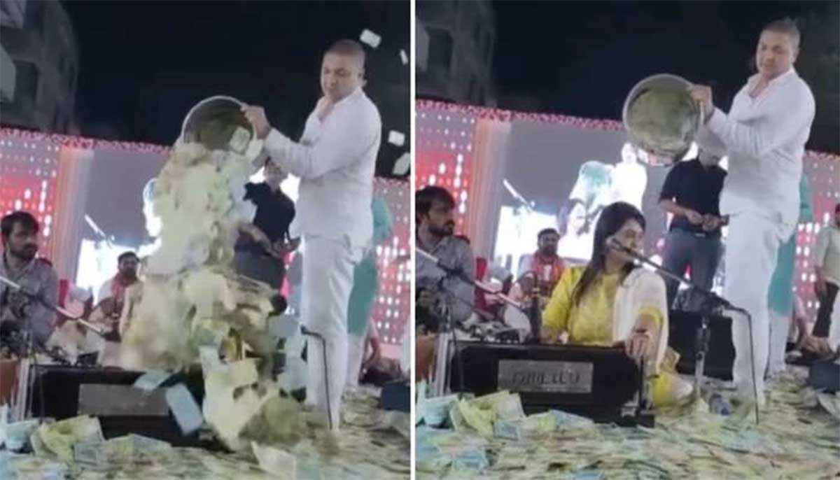 Viral News man poured currency notes on his favorite singer 