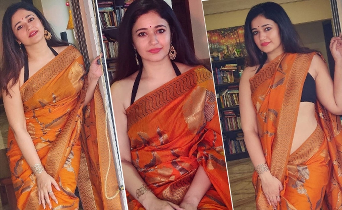Poonam Bajwa new orange saree pics going viral 