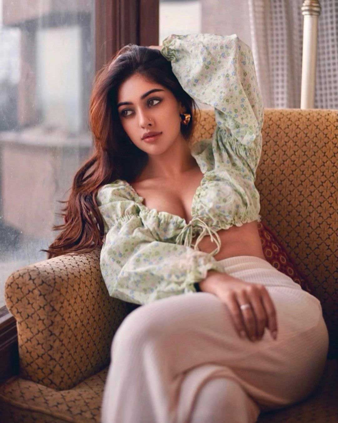 Anu Emmanuel sitting on sofa latest photos 